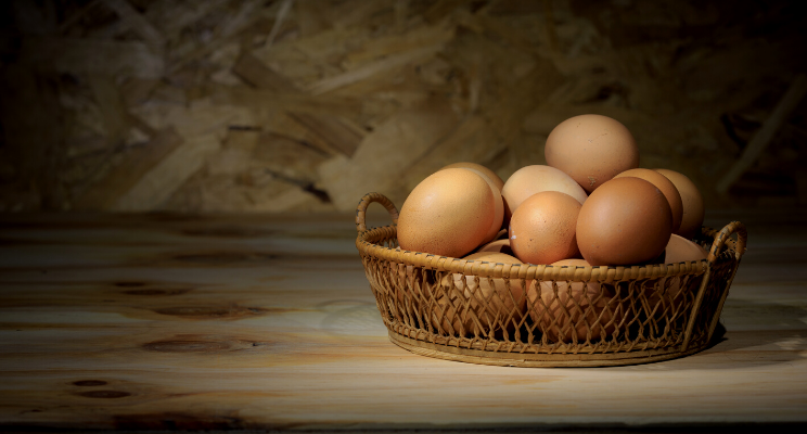 several eggs in a wicker basket