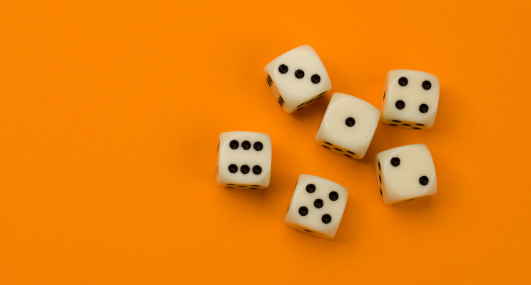 dice scattered against orange background