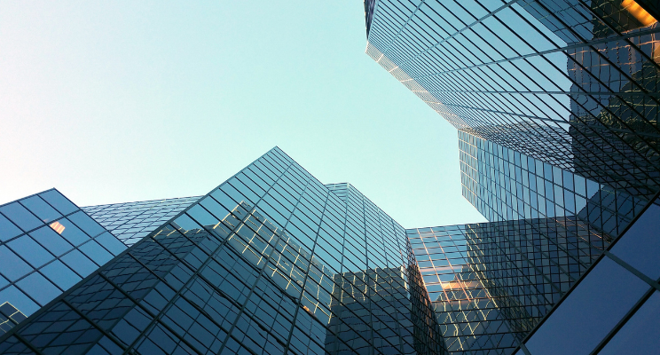 bottom up view inbetween skyscraper buildings