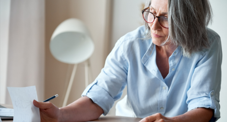 woman concentrating on paperwork